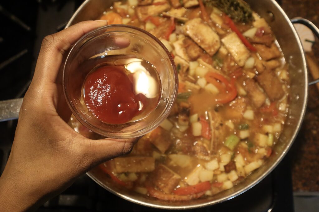 Ketchup and agave nectar over brown stew tofu