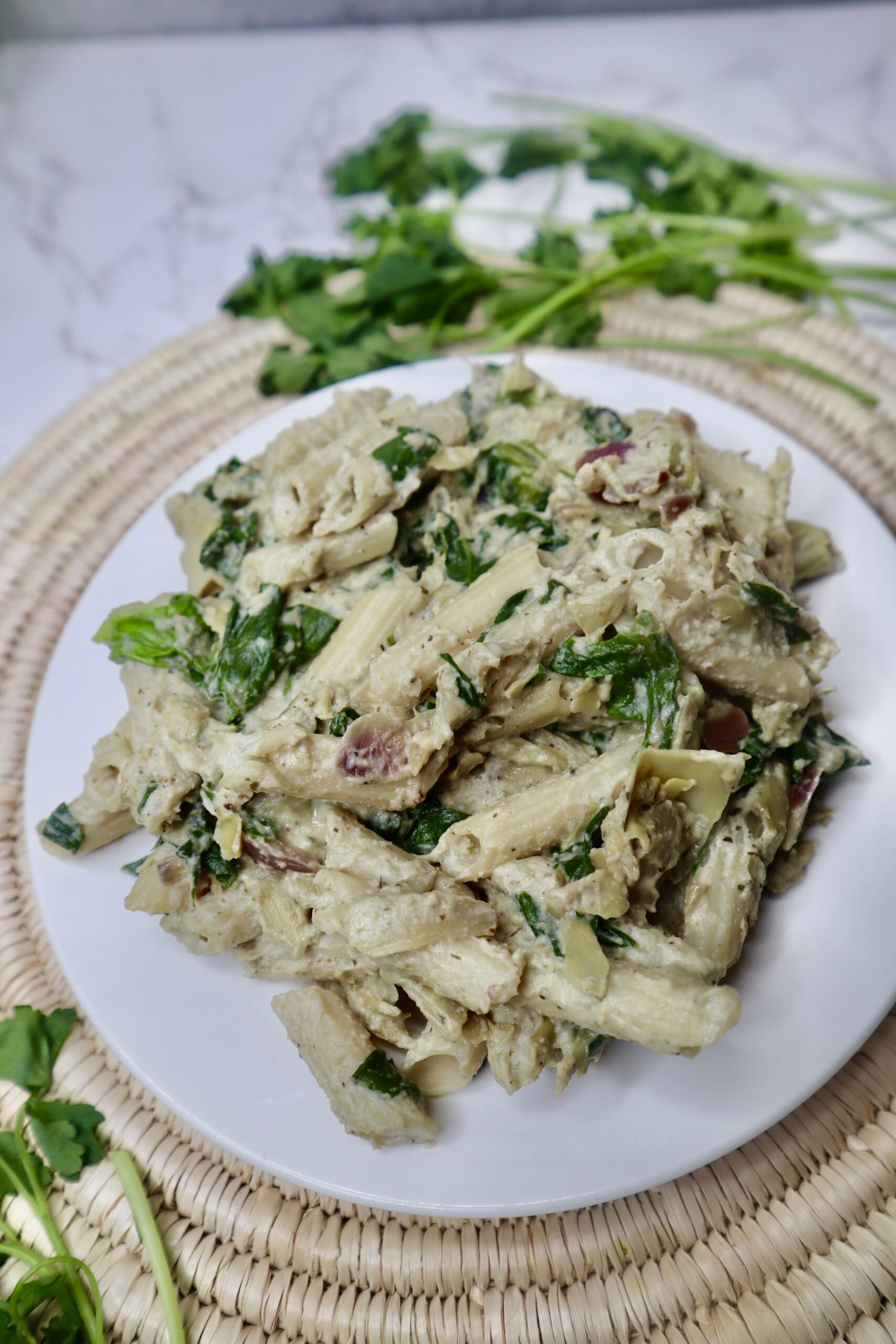 creamy cheesy vegan spinach artichoke pasta