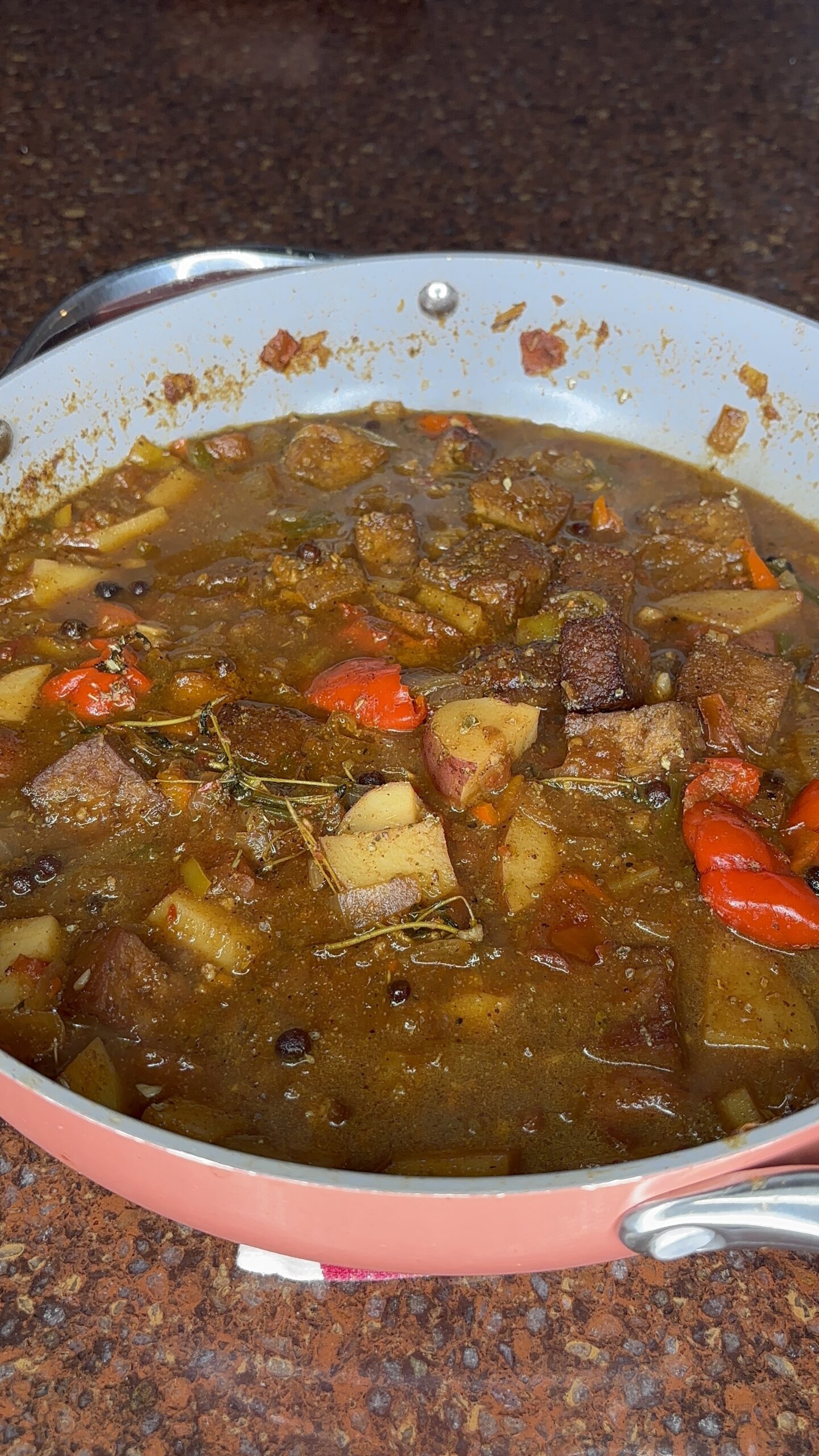 vegan brown stew tofu in a pink pan