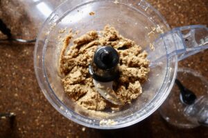 Combined chocolate chip energy ball ingredients in a food processor 