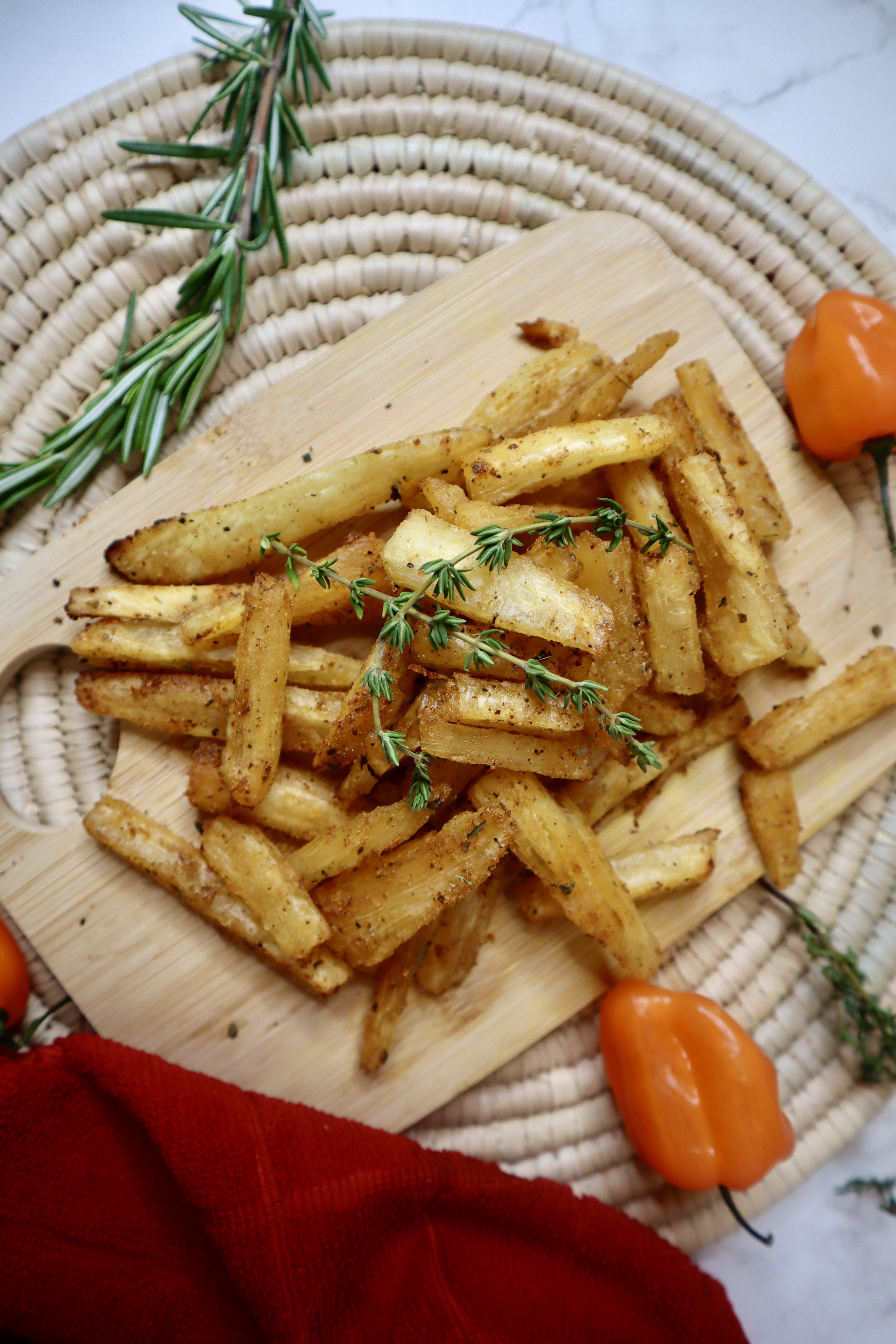 Cassava fries next to red kitchen towel