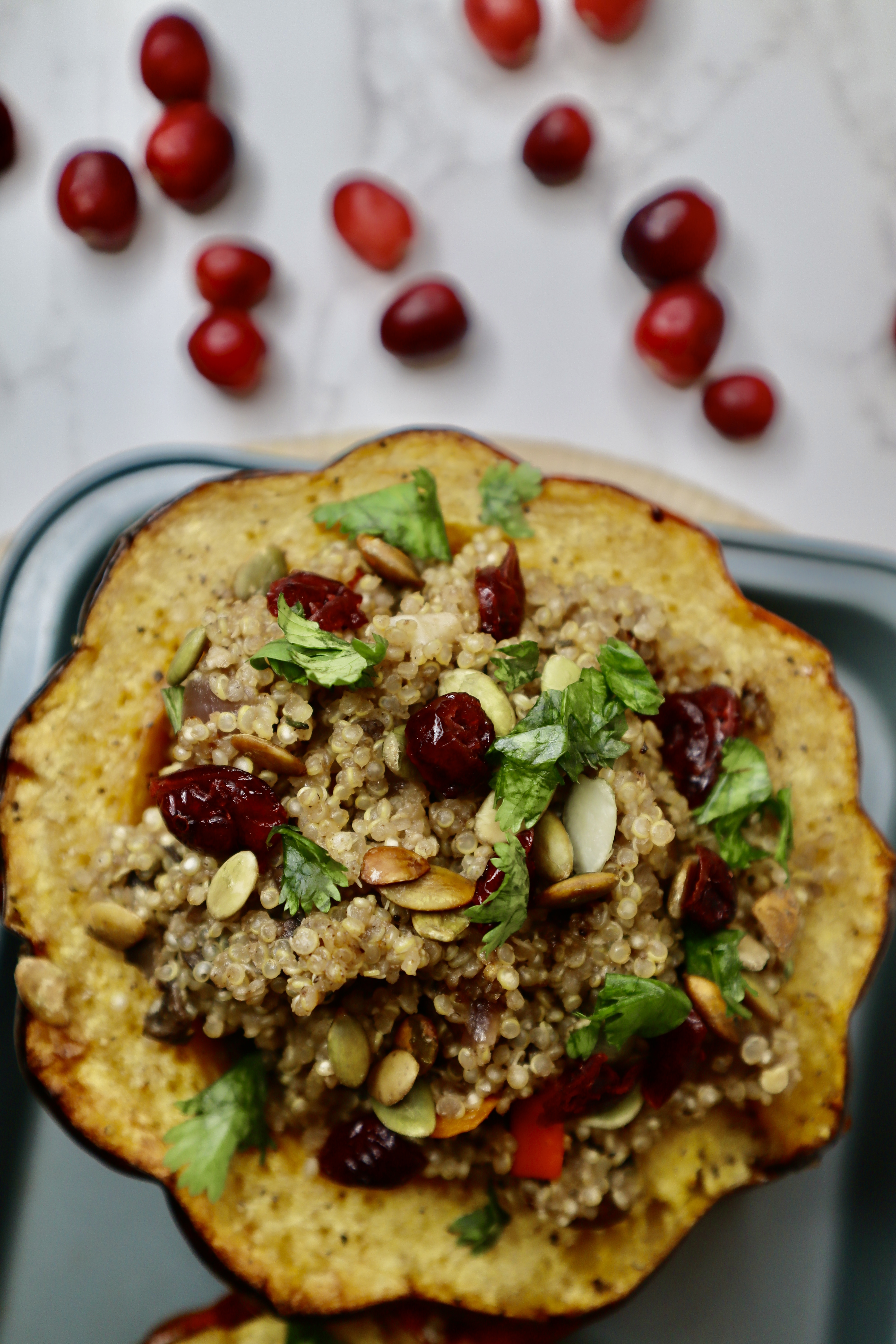 Stuffed acorn squash on baking tray