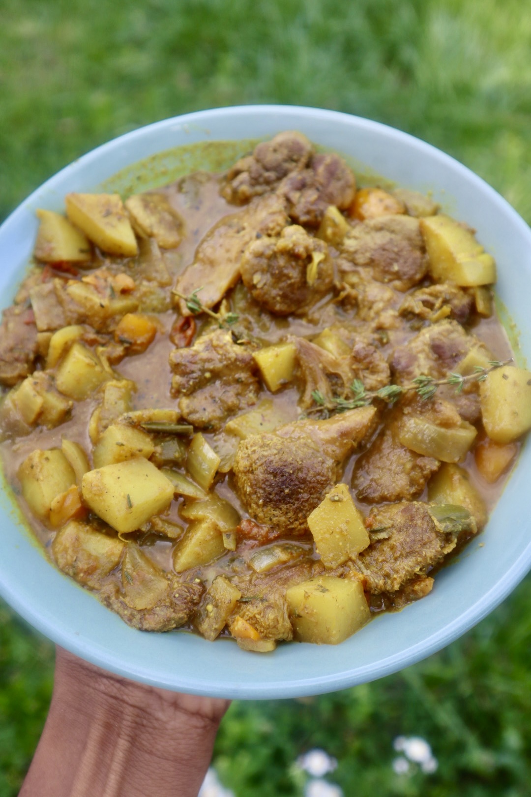 vegan Jamaican curry chicken in blue bowl