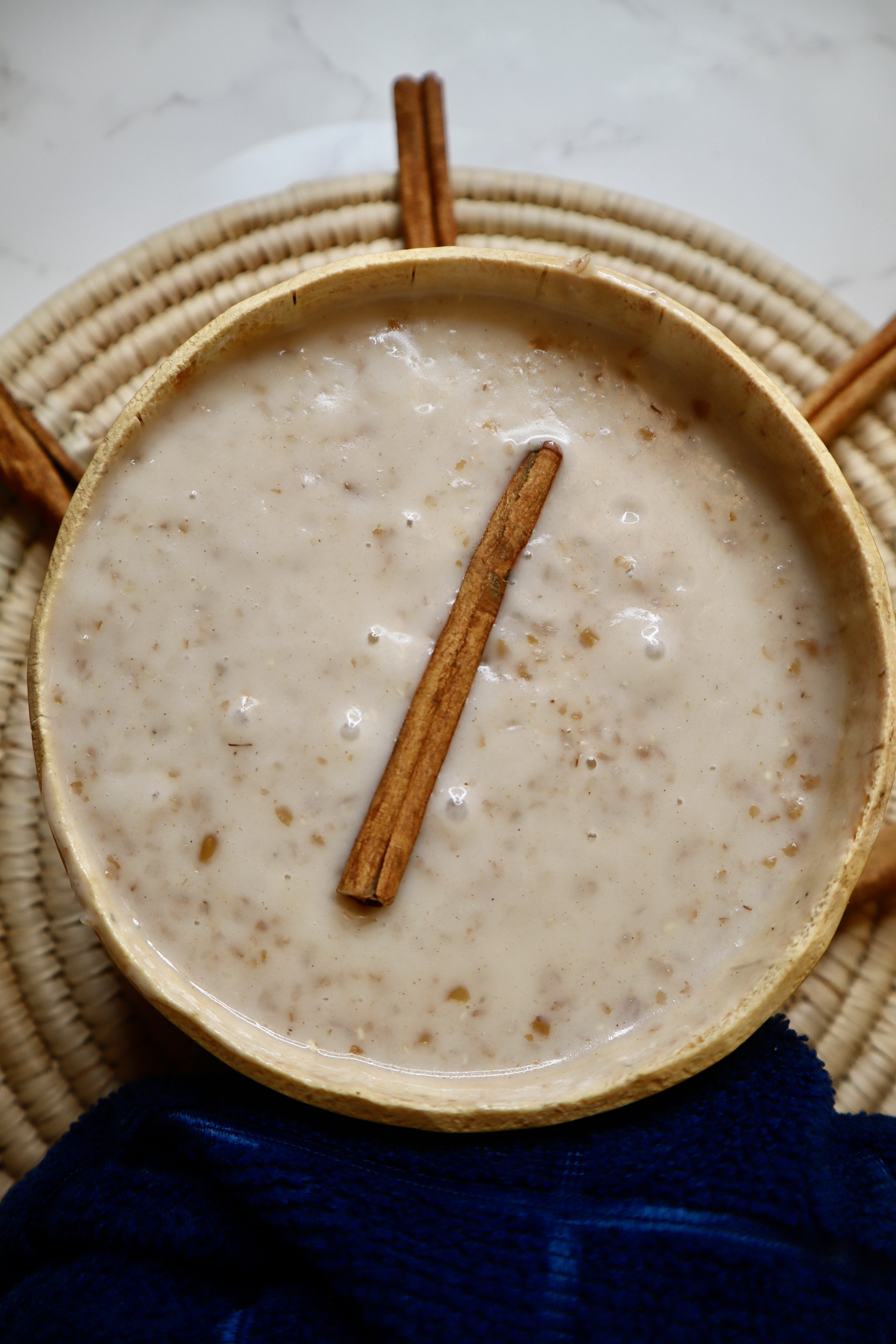 Jamaican bulgar wheat porridge with cinnamon stick decorated on top