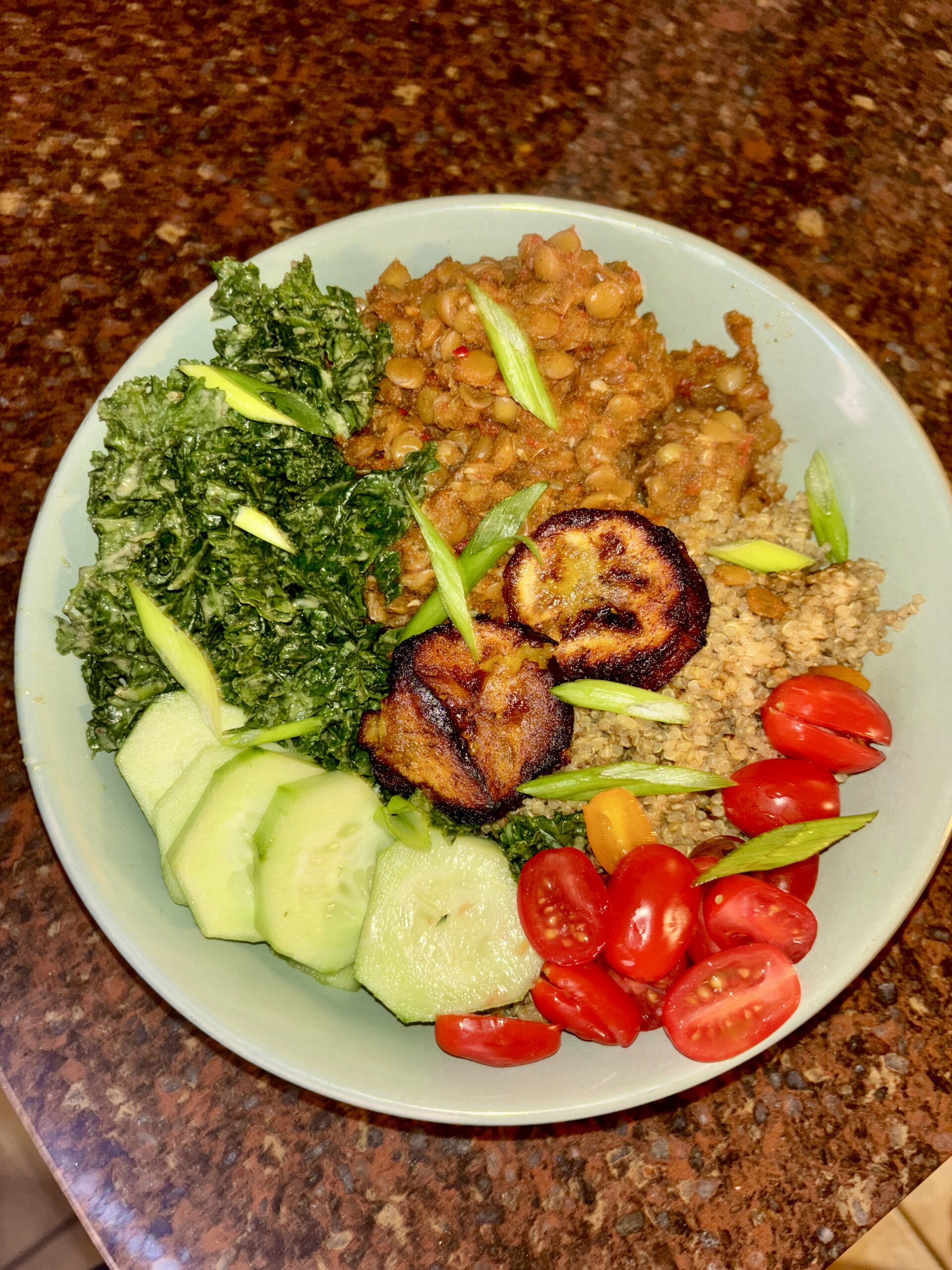 spicy harissa lentils with cucumber, tomato, kale, and plantain