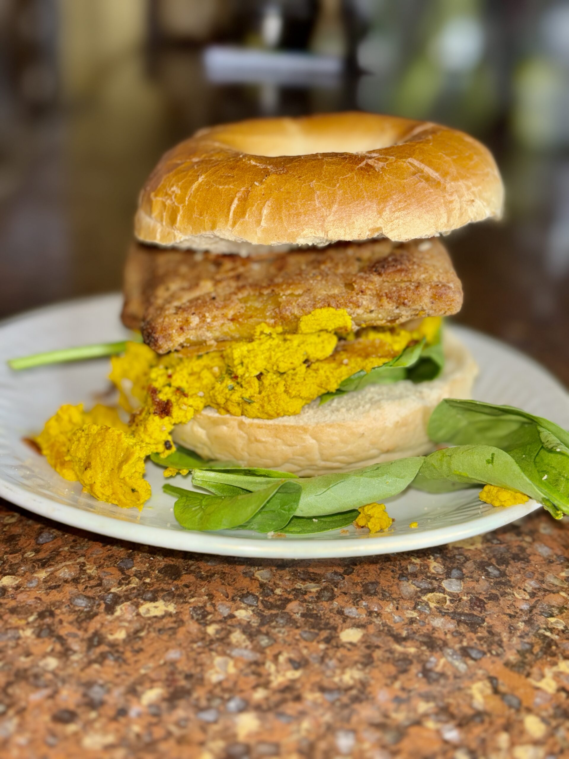 the uptime Vegan breakfast sandwich on a white plate