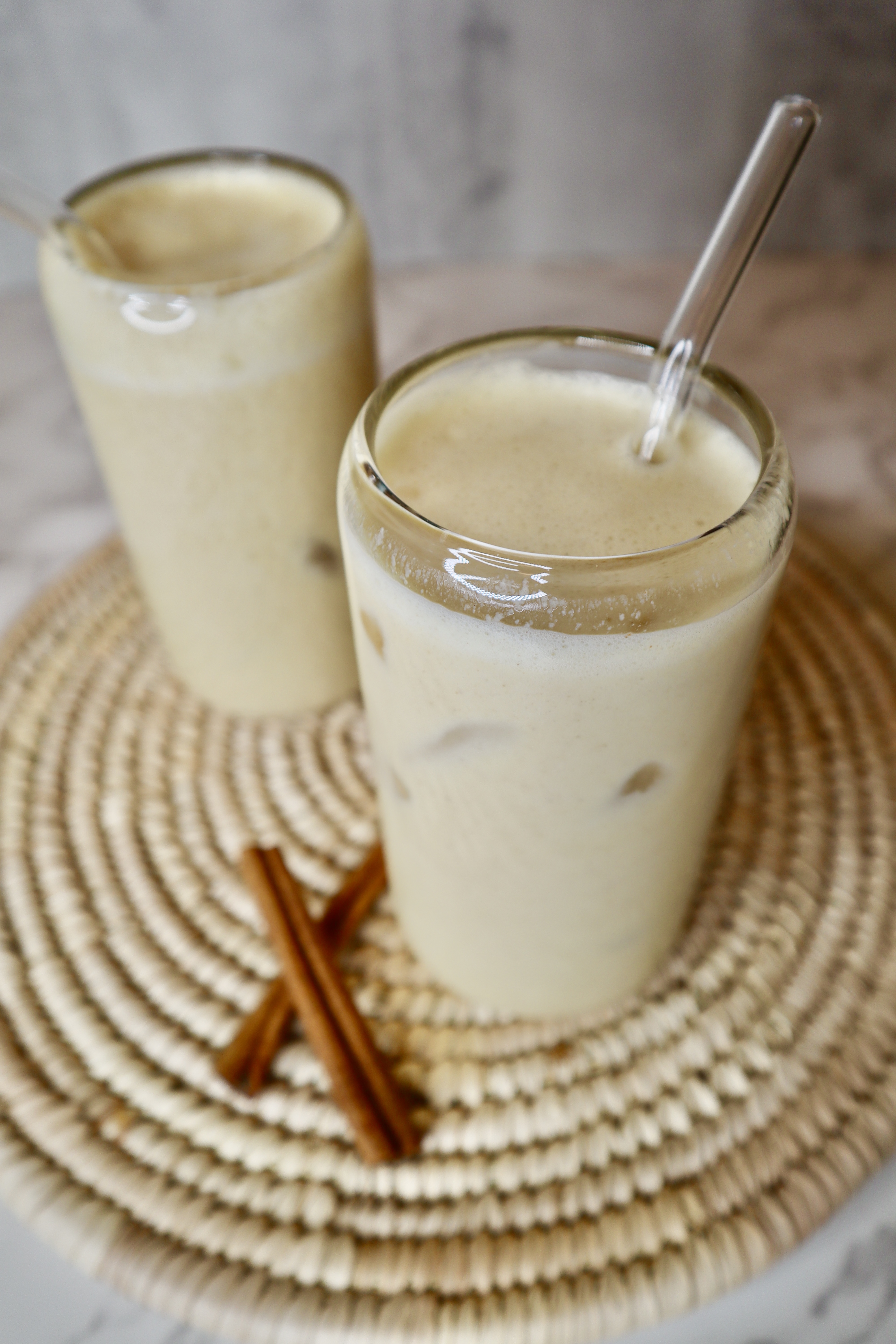 2 glasses of Jamaican ackee punch with straws