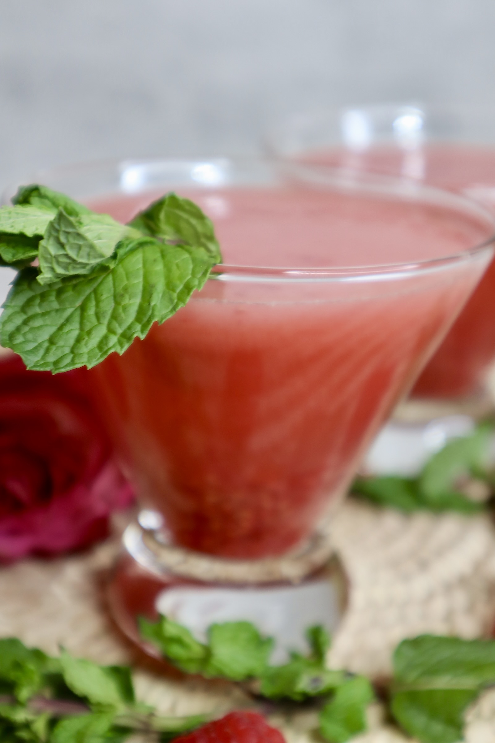 raspberry ginger mocktail topped with mint