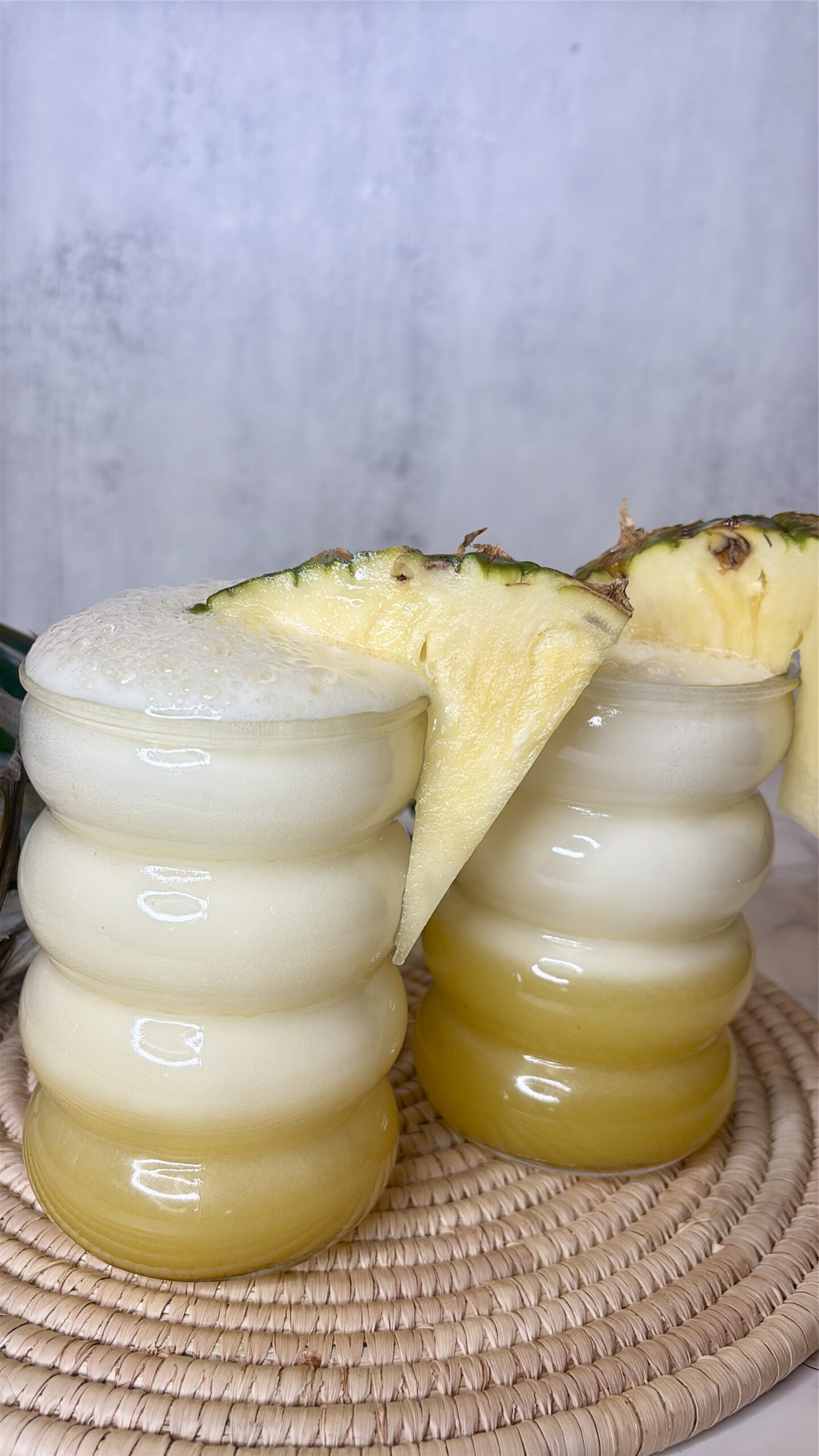 pineapple soda in bubble cups topped with pineapple slices
