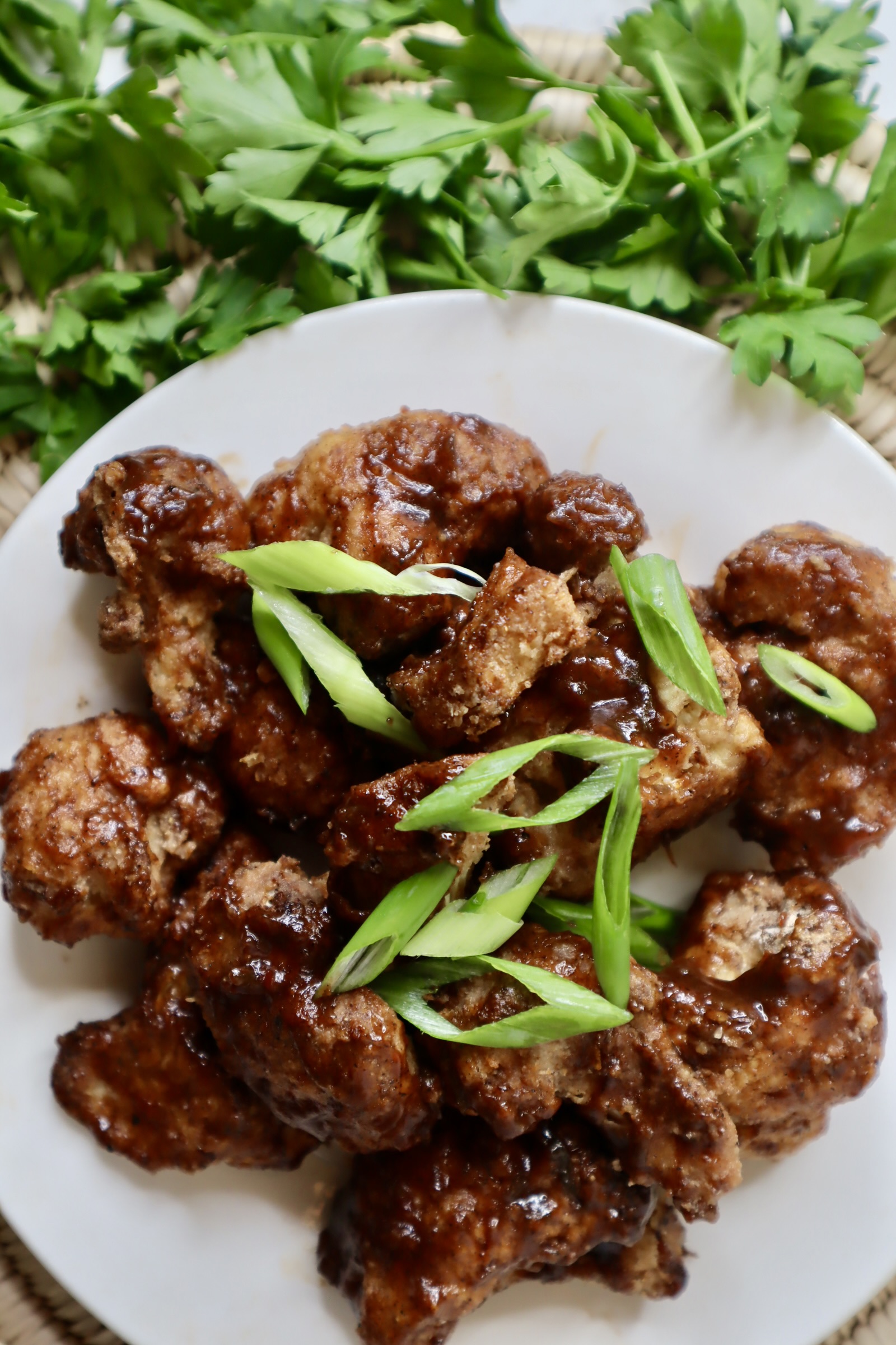 jerk bbq cauliflower wings toped with scallion
