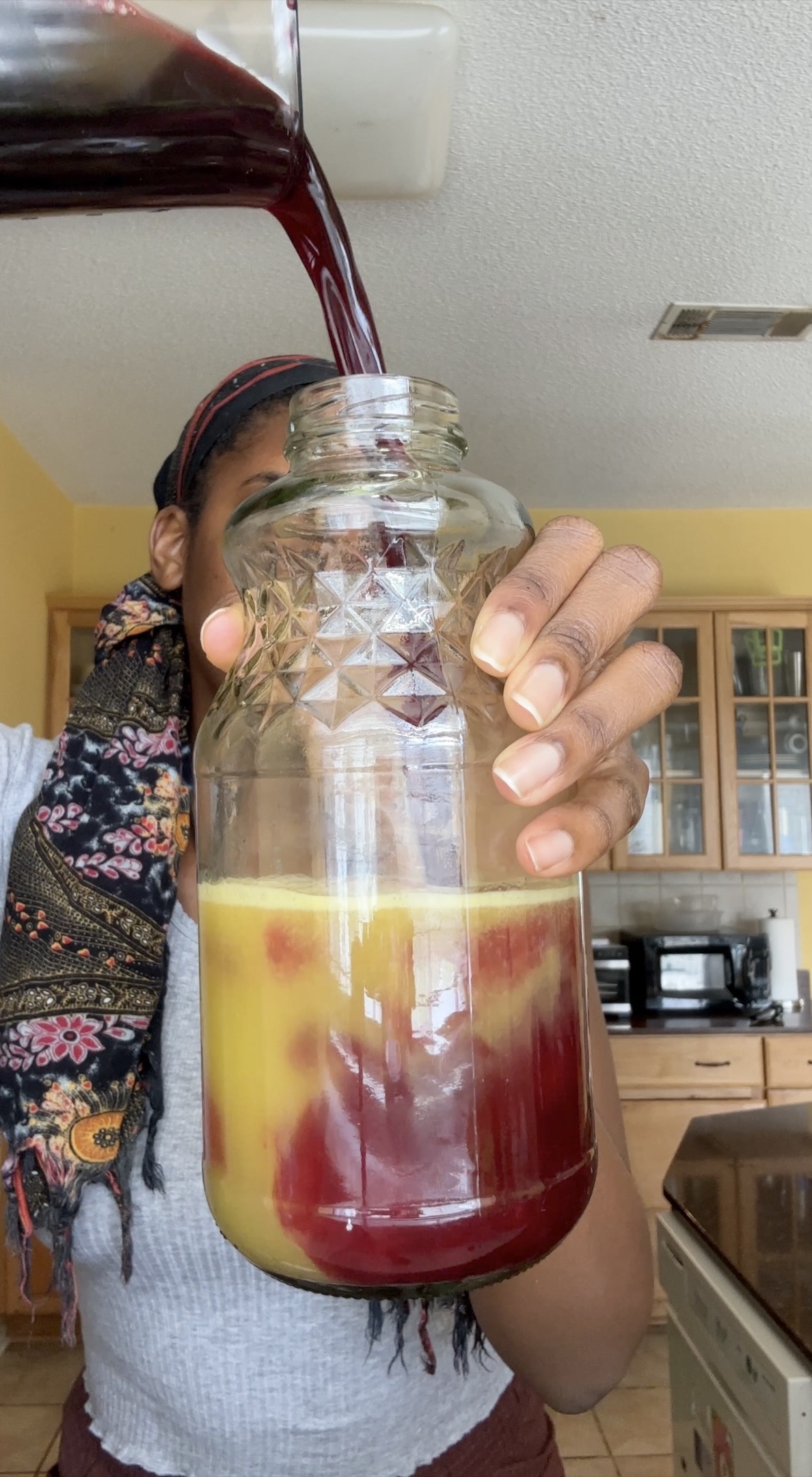 iced sorrel being poured into pineapple juice
