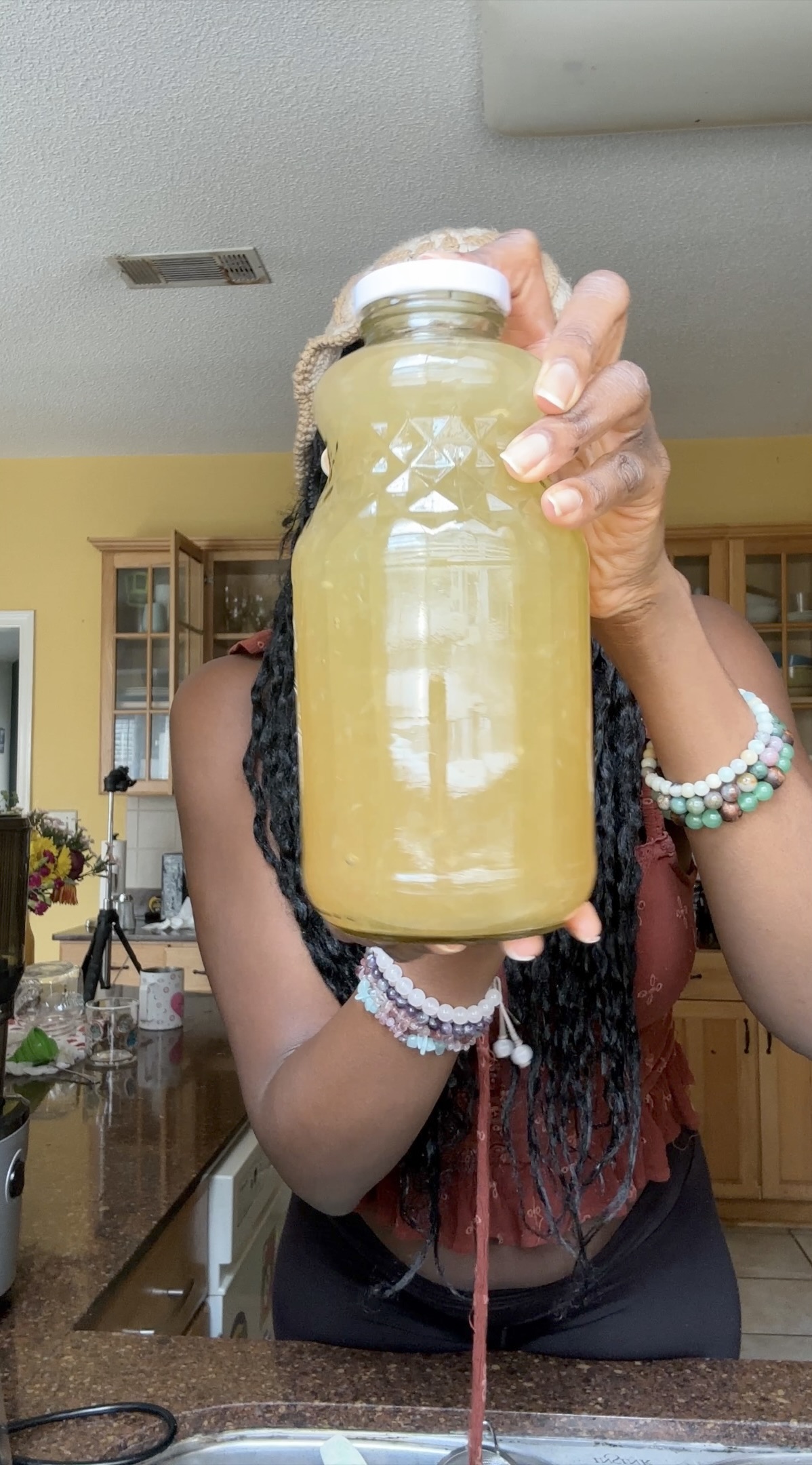 woman holding liter jar of lemonade