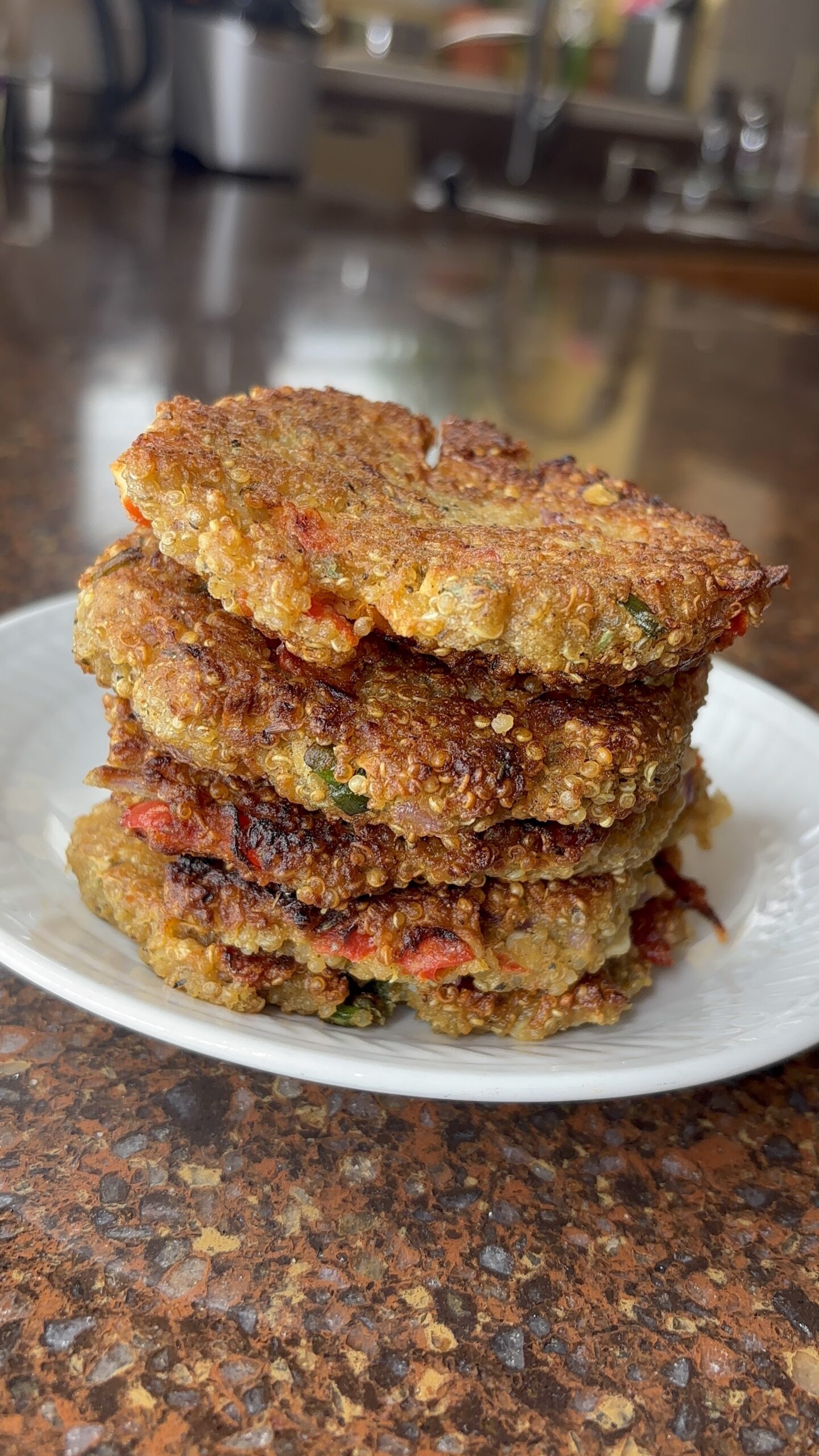 close up of quinoa fritters on a white plate