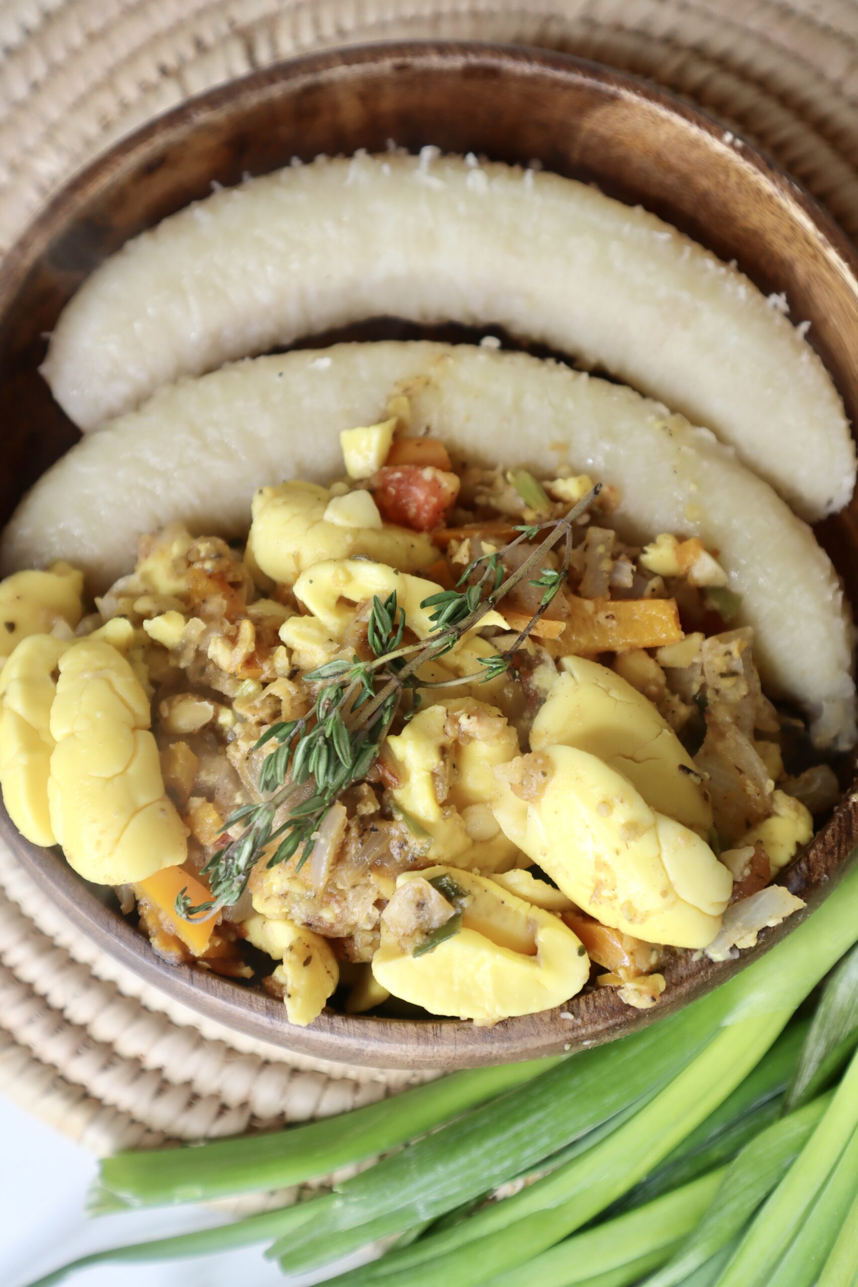 vegan ackee next to boiled green banana