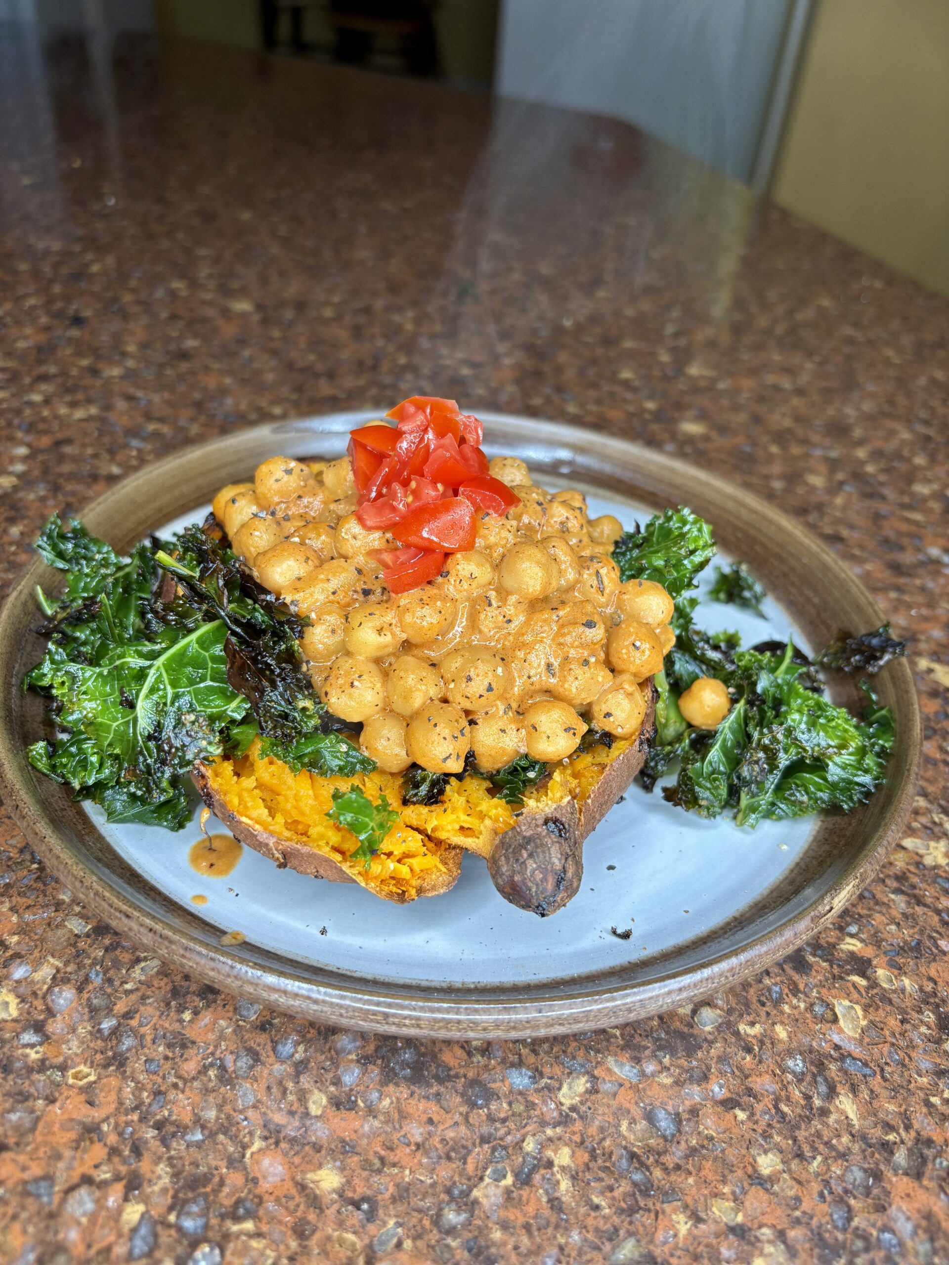marry me chickpeas topped with chopped tomatoes